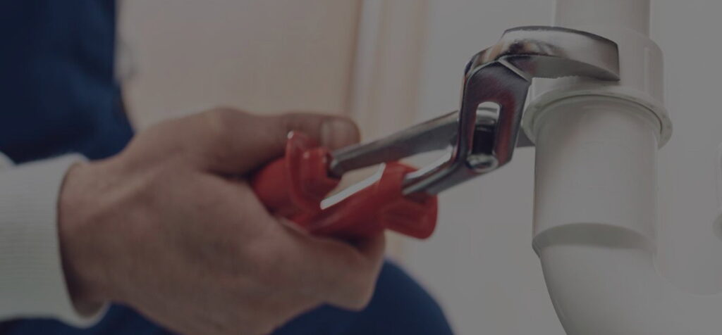 Prepared residential plumbing technician with service equipment.